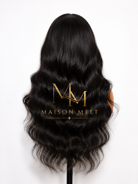 Black wavy hair extension with Maison Melt logo on a white background