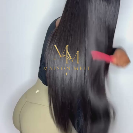 Girl combing straight hair